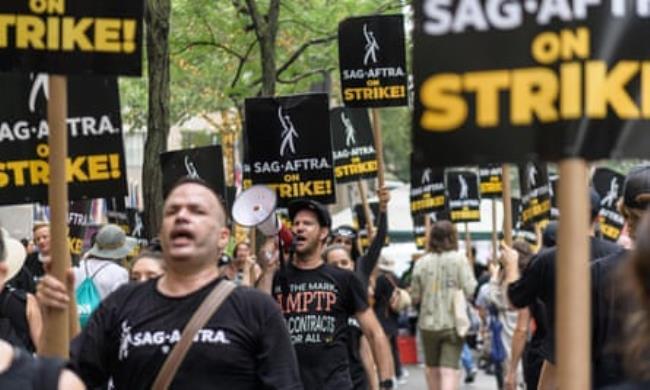 Sag-Aftra members and supporters walk the picket line as Screen Actors Guild members strike in New York in July